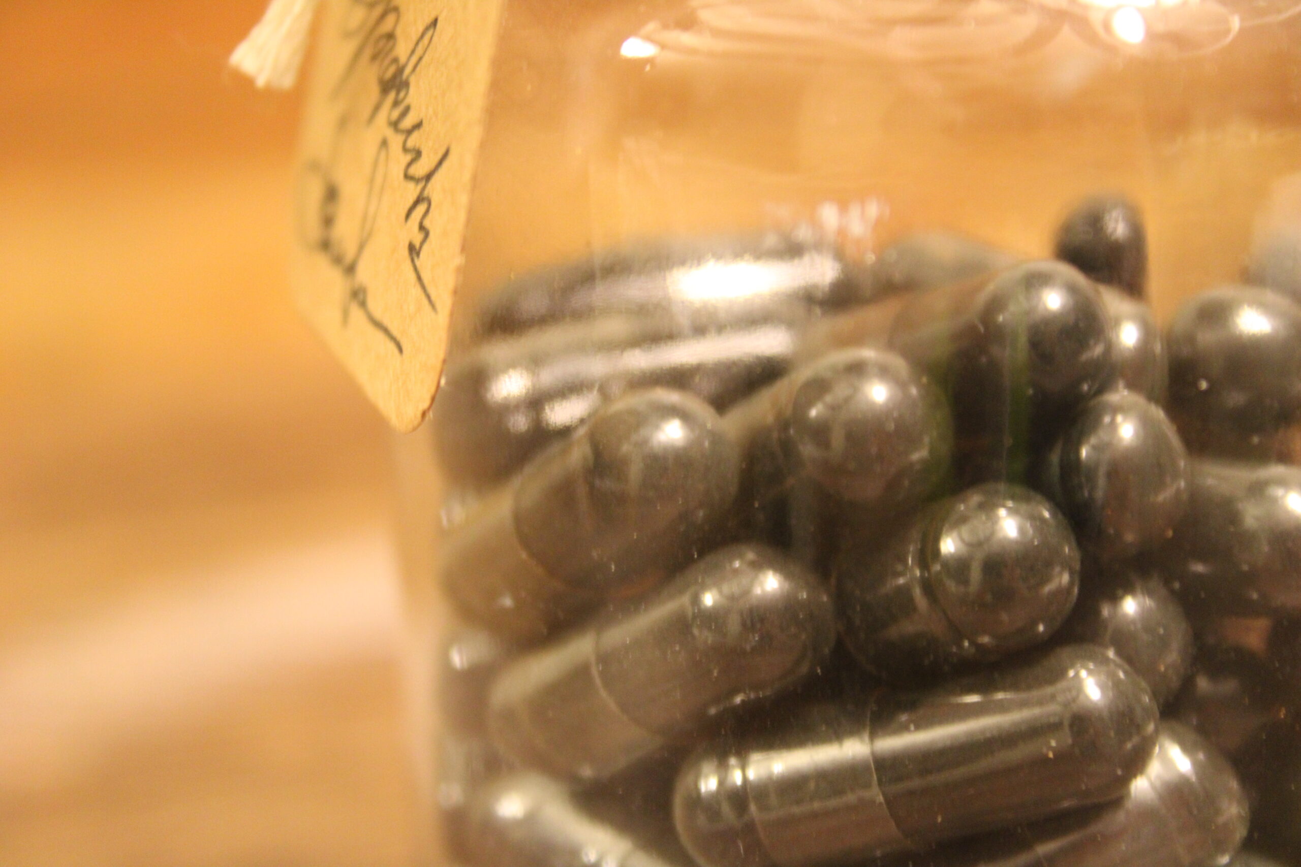 A close up of some pills in a jar